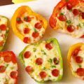 Mini pizzas with bell peppers, cheese and pizza sauce